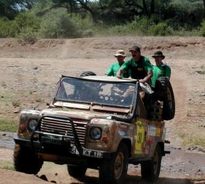 A team crosses an almost-dry riverbed A team crosses an almost-dry riverbed